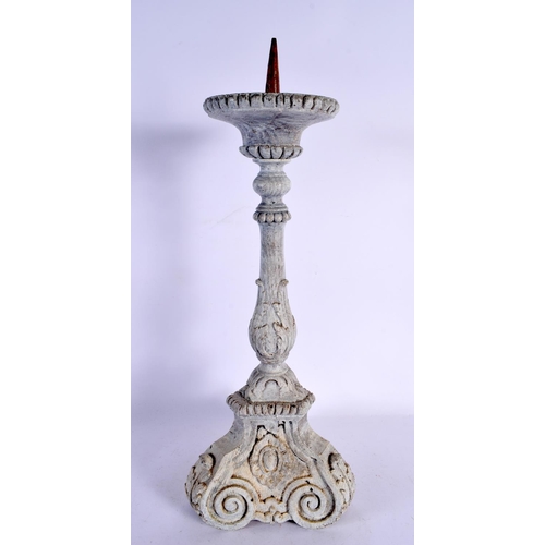 569 - A LARGE 18TH CENTURY CONTINENTAL BAROQUE PAINTED WOOD CANDLESTICK. 49 cm high.