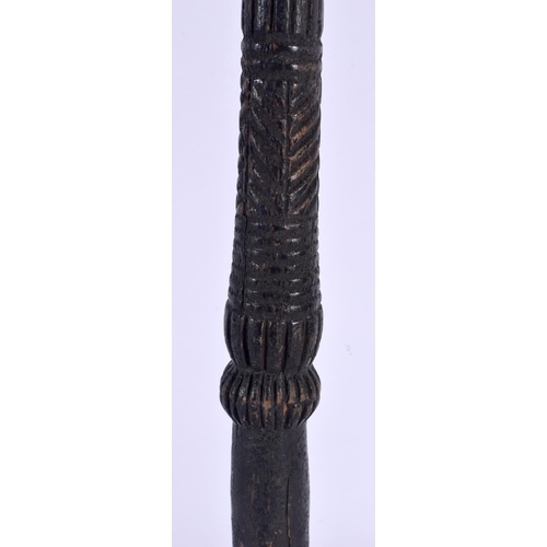 571 - A LARGE 19TH CENTURY CONTINENTAL CARVED TRIBAL CHIEFS STAFF of figural form. 51 cm high.