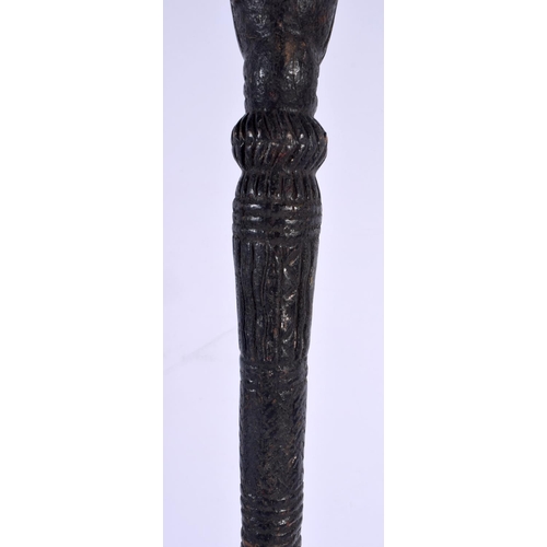 571 - A LARGE 19TH CENTURY CONTINENTAL CARVED TRIBAL CHIEFS STAFF of figural form. 51 cm high.