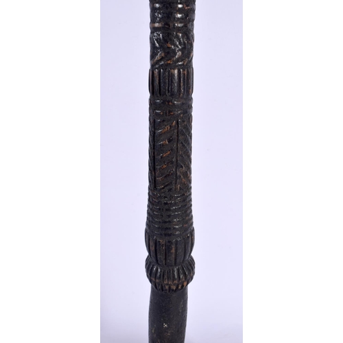 571 - A LARGE 19TH CENTURY CONTINENTAL CARVED TRIBAL CHIEFS STAFF of figural form. 51 cm high.