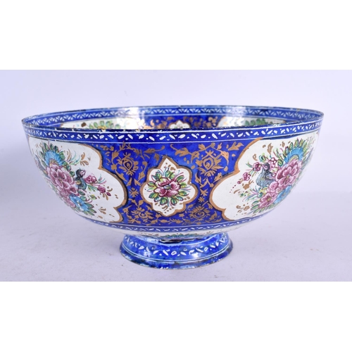 575 - A 19TH CENTURY MIDDLE EASTERN PERSIAN ENAMEL BOWL painted with flowers. 18 cm diameter.