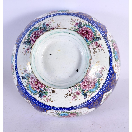 575 - A 19TH CENTURY MIDDLE EASTERN PERSIAN ENAMEL BOWL painted with flowers. 18 cm diameter.