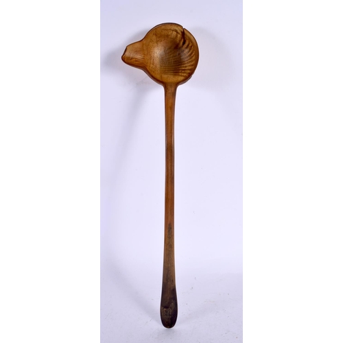 576 - A 19TH CENTURY MIDDLE EASTERN CARVED RHINOCEROS HORN LADLE. 40 cm high.