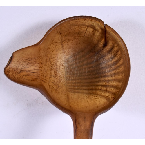 576 - A 19TH CENTURY MIDDLE EASTERN CARVED RHINOCEROS HORN LADLE. 40 cm high.
