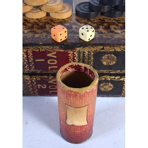 580 - AN ANTIQUE COUNTRY HOUSE FAUX BOOK LEATHER GAMING BOX with accompanying backgammon counters. Box 40 ... 