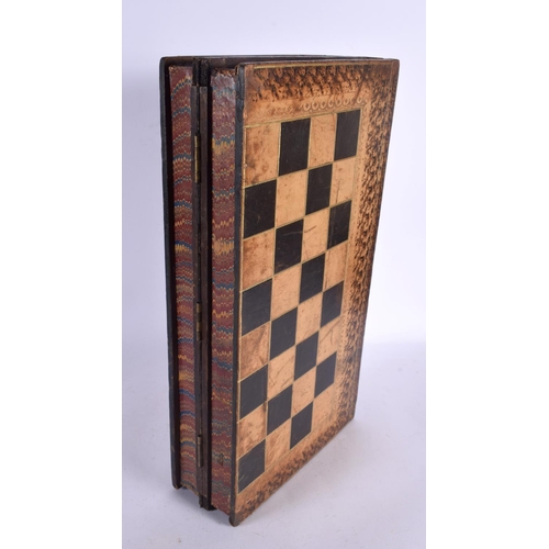 580 - AN ANTIQUE COUNTRY HOUSE FAUX BOOK LEATHER GAMING BOX with accompanying backgammon counters. Box 40 ... 