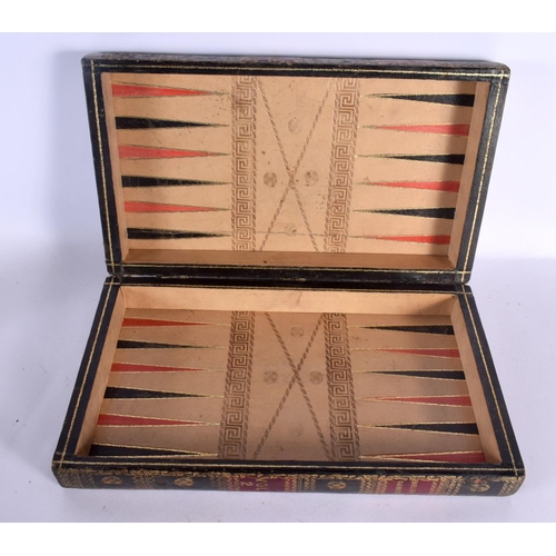 580 - AN ANTIQUE COUNTRY HOUSE FAUX BOOK LEATHER GAMING BOX with accompanying backgammon counters. Box 40 ... 