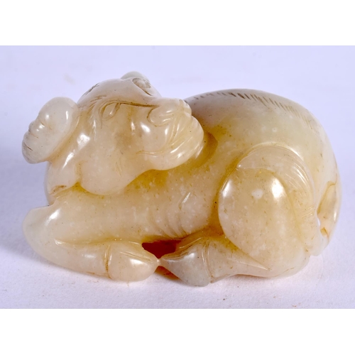 583 - A CHINESE CARVED JADE BULL 20th Century. 6 cm x 3 cm.