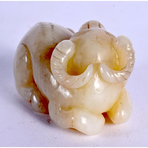 583 - A CHINESE CARVED JADE BULL 20th Century. 6 cm x 3 cm.