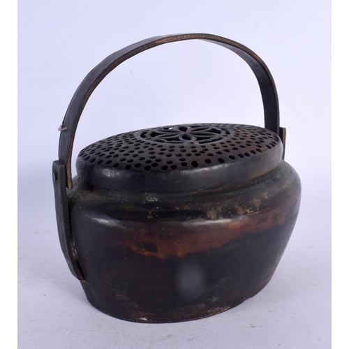 584 - A CHINESE SWING HANDLED CENSER AND COVER 20th Century. 13 cm x 15 cm.