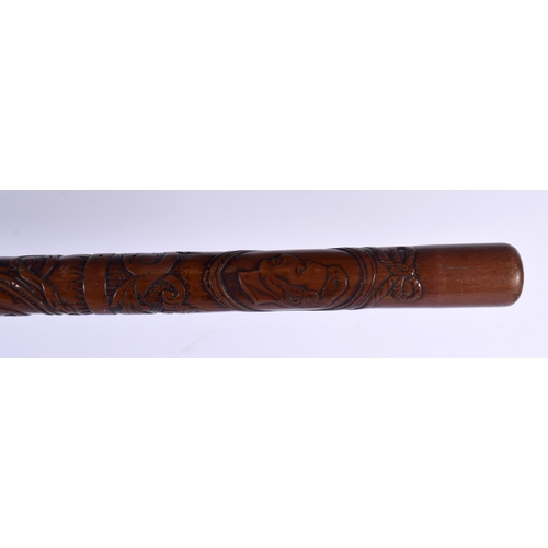 596 - A RARE AFRICAN TRIBAL CARVED WOOD TRIBAL STAFF. 81 cm long.