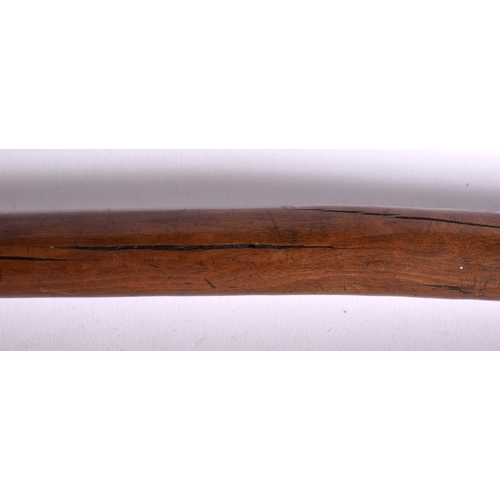 599 - A 19TH CENTURY FIJIAN TRIBAL CARVED WOOD CLUB with gnarled terminal. 78 cm long.