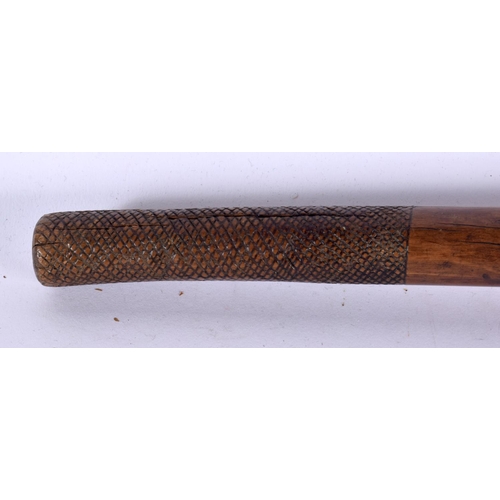 599 - A 19TH CENTURY FIJIAN TRIBAL CARVED WOOD CLUB with gnarled terminal. 78 cm long.