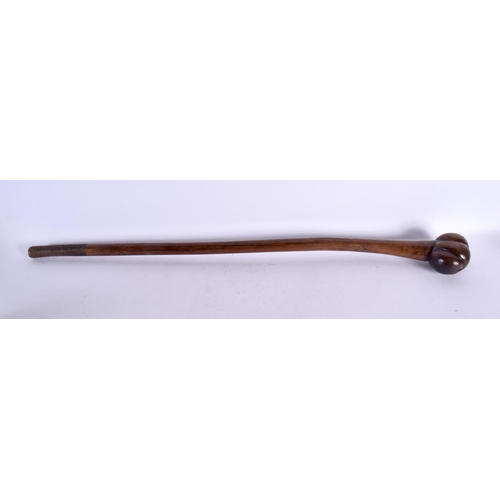 599 - A 19TH CENTURY FIJIAN TRIBAL CARVED WOOD CLUB with gnarled terminal. 78 cm long.