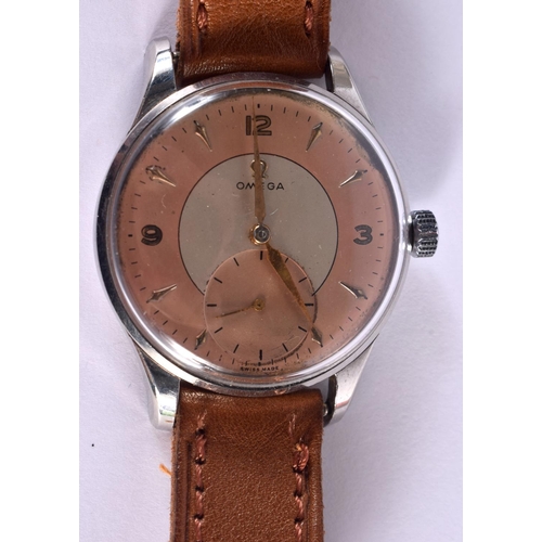 661 - A VINTAGE OMEGA PEACH DIAL WRISTWATCH. 3.75 cm wide inc winder.
