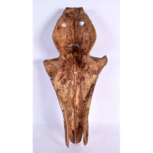 70 - A RARE 19TH CENTURY CONTINENTAL TRIBAL CARVED AND ENGRAVED HORSE SKULL decorated with animals and mo... 