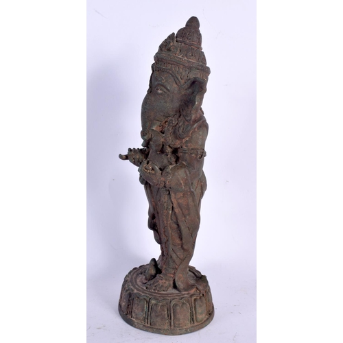 73 - A FINE EARLY INDIAN BRONZE FIGURE OF GANESHA Karnataka, Possibly Western Chalukya Period, modelled s... 