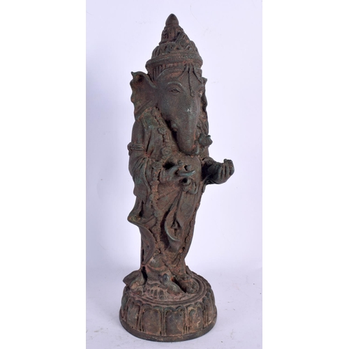 73 - A FINE EARLY INDIAN BRONZE FIGURE OF GANESHA Karnataka, Possibly Western Chalukya Period, modelled s... 