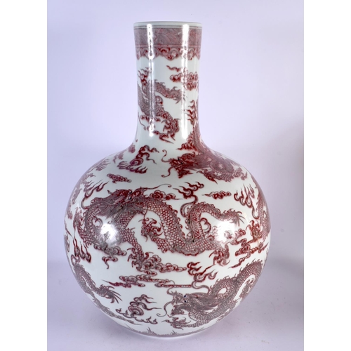 743C - A LARGE CHINESE IRON RED GLAZED PORCELAIN BULBOUS VASE probably 19th century, bearing Qianlong marks... 