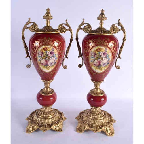 743D - A PAIR OF PAIR OF CONTINENTAL TWIN HANDLED PORCELAIN VASES with bronze mounts. 46 cm x 15 cm.