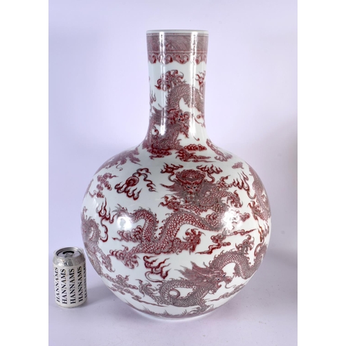 743C - A LARGE CHINESE IRON RED GLAZED PORCELAIN BULBOUS VASE probably 19th century, bearing Qianlong marks... 