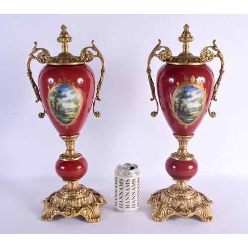 743D - A PAIR OF PAIR OF CONTINENTAL TWIN HANDLED PORCELAIN VASES with bronze mounts. 46 cm x 15 cm.