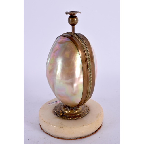 745B - A 19TH CENTURY FRENCH MOTHER OF PEARL GILT METAL SCENT BOTTLE HOLDER in the form of an egg. 14.5 cm ... 