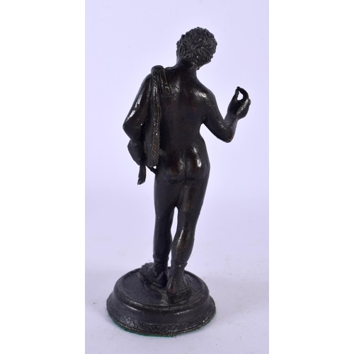 746A - A 19TH CENTURY EUROPEAN GRAND TOUR FIGURE OF A MALE modelled upon a circular base. 14 cm high.