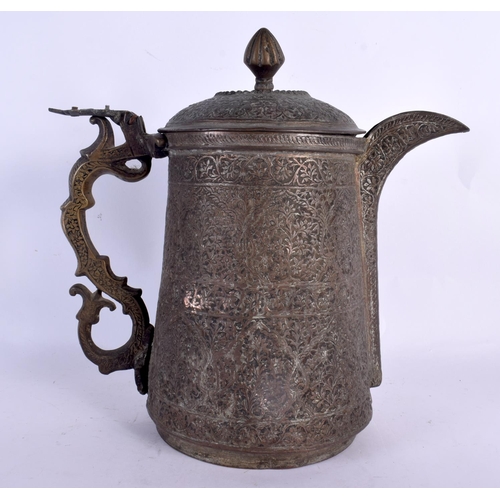 75 - A LARGE 17TH/18TH CENTURY MIDDLE EASTERN MIXED ALLOY JUG AND COVER decorated all over with foliage a... 