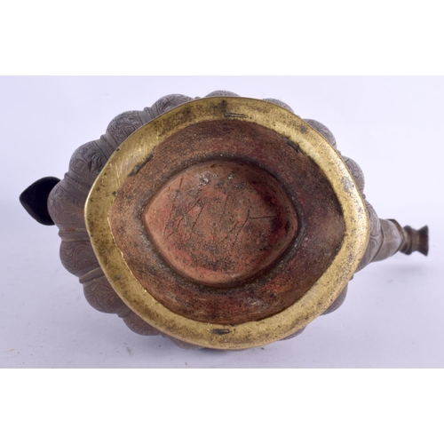 77 - A LARGE 18TH CENTURY MIDDLE EASTERN OTTOMAN TYPE BRONZE EWER decorated all over with foliage and vin... 