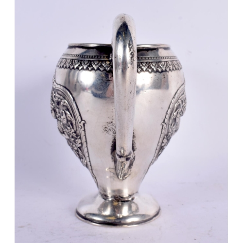 80 - A 19TH CENTURY SOUTH EAST ASIAN CHINESE TIBETAN SILVER JUG decorated with Buddhistic figures. 153 gr... 