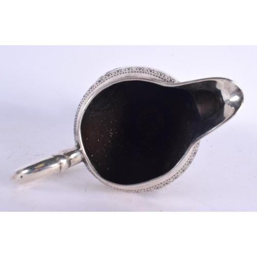 80 - A 19TH CENTURY SOUTH EAST ASIAN CHINESE TIBETAN SILVER JUG decorated with Buddhistic figures. 153 gr... 