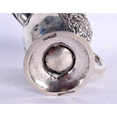 80 - A 19TH CENTURY SOUTH EAST ASIAN CHINESE TIBETAN SILVER JUG decorated with Buddhistic figures. 153 gr... 