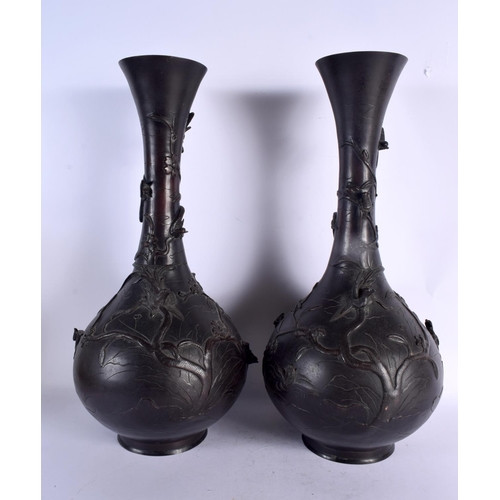 83 - A VERY LARGE PAIR OF 19TH CENTURY JAPANESE MEIJI PERIOD BRONZE VASES decorated with foliage and bird... 