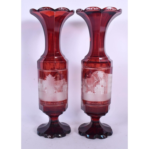 86 - A PAIR OF LATE 19TH CENTURY BOHEMIAN CRANBERRY GLASS VASES engraved with The Great Exhibition Indust... 