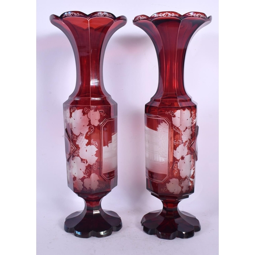 86 - A PAIR OF LATE 19TH CENTURY BOHEMIAN CRANBERRY GLASS VASES engraved with The Great Exhibition Indust... 