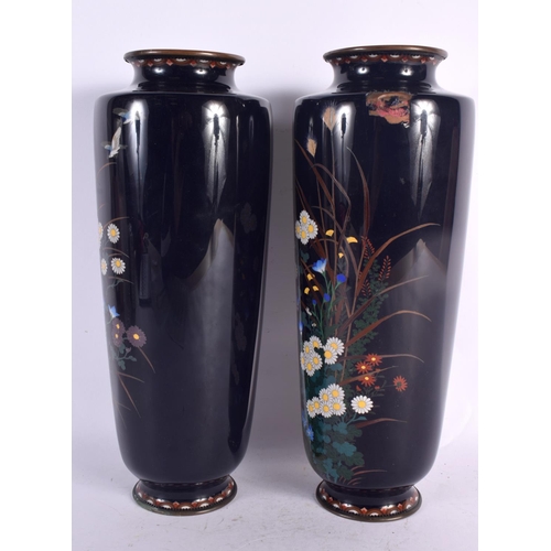 87 - A LARGE PAIR OF LATE 19TH CENTURY JAPANESE MEIJI PERIOD CLOISONNE ENAMEL VASES decorated with foliag... 