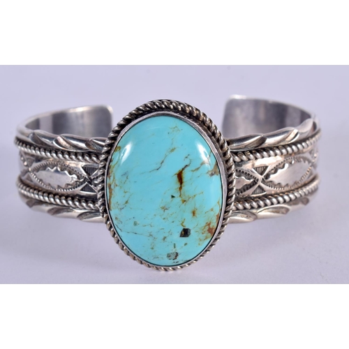 1284 - NATIVE AMERICAN SILVER AND TURQUOISE BANGLE.  Stamped Sterling, 6.1cm x 4.6cm, weight 71.3g