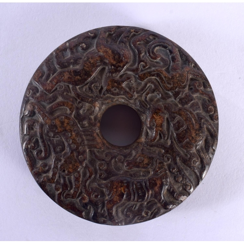 1549 - An 18TH / 19TH CENTURY CHINESE CARVED HARDSTONE BI DISK finely carved with Kylin, deer and tiger, 7c... 