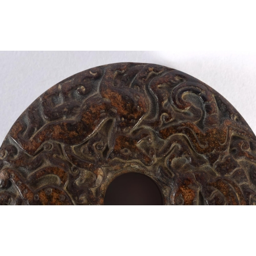 1549 - An 18TH / 19TH CENTURY CHINESE CARVED HARDSTONE BI DISK finely carved with Kylin, deer and tiger, 7c... 