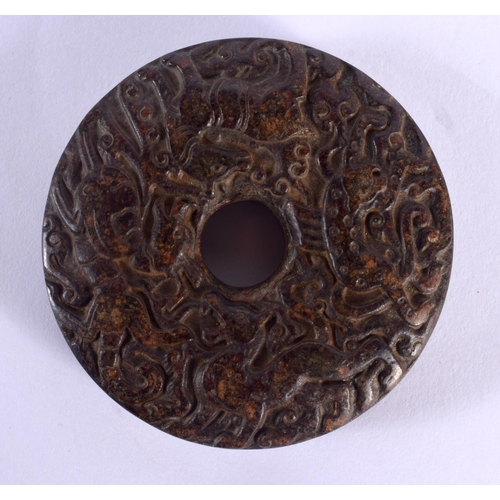 1549 - An 18TH / 19TH CENTURY CHINESE CARVED HARDSTONE BI DISK finely carved with Kylin, deer and tiger, 7c... 