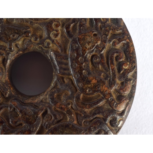 1549 - An 18TH / 19TH CENTURY CHINESE CARVED HARDSTONE BI DISK finely carved with Kylin, deer and tiger, 7c... 