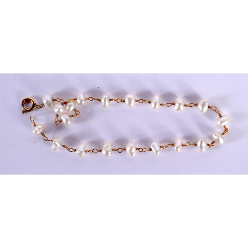 1552 - A 20TH CENTURY LADIES PEARL AND GOLD BRACELET  with 20 natural pearls mounted upon a delicate gold c... 