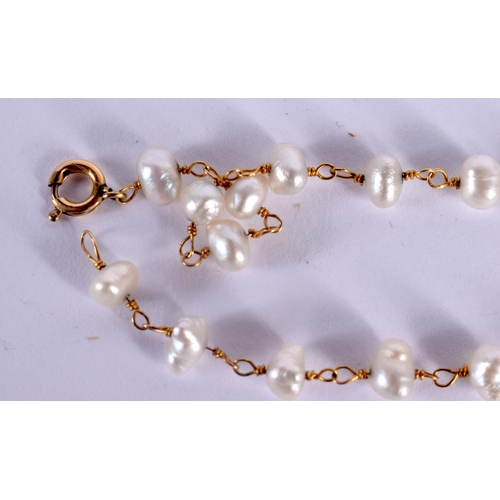 1552 - A 20TH CENTURY LADIES PEARL AND GOLD BRACELET  with 20 natural pearls mounted upon a delicate gold c... 