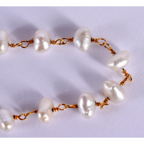 1552 - A 20TH CENTURY LADIES PEARL AND GOLD BRACELET  with 20 natural pearls mounted upon a delicate gold c... 