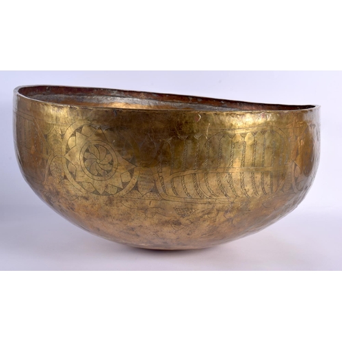 1553 - A 12TH / 13TH CENTURY CENTRAL ASIAN LARGE ENGRAVED CALLIGRAPHY BOWL hammered brass with engraved mot... 