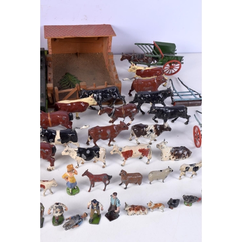 3677 - A vintage child's farm yard set with wooden buildings and a large collection of painted lead animals