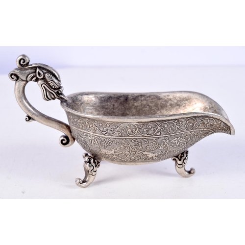 3679 - A Chinese embossed white metal sauce pot with Dragon handle 7.5 x 13 cm .