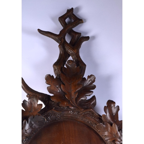 3750 - A carved black forest wooden  bear mirror surround 123 x 70 cm