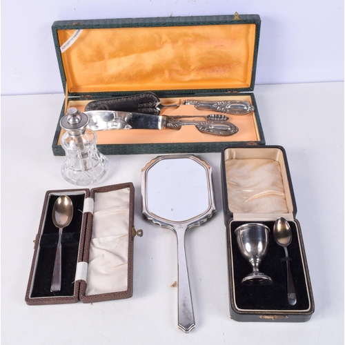 3767 - A collection of silver and plated items Egg cup and spoons, mirror etc (5)